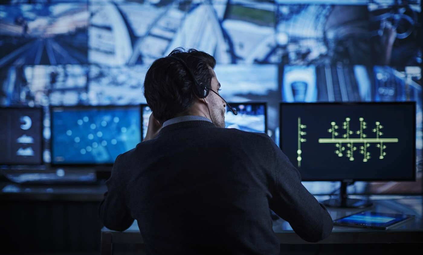 A person checking several screens.