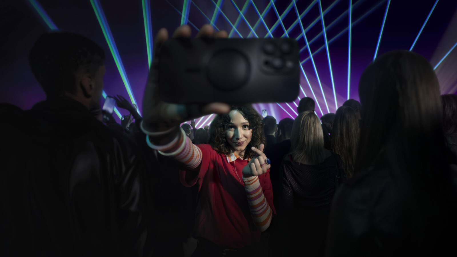 Lady taking selfie in an event