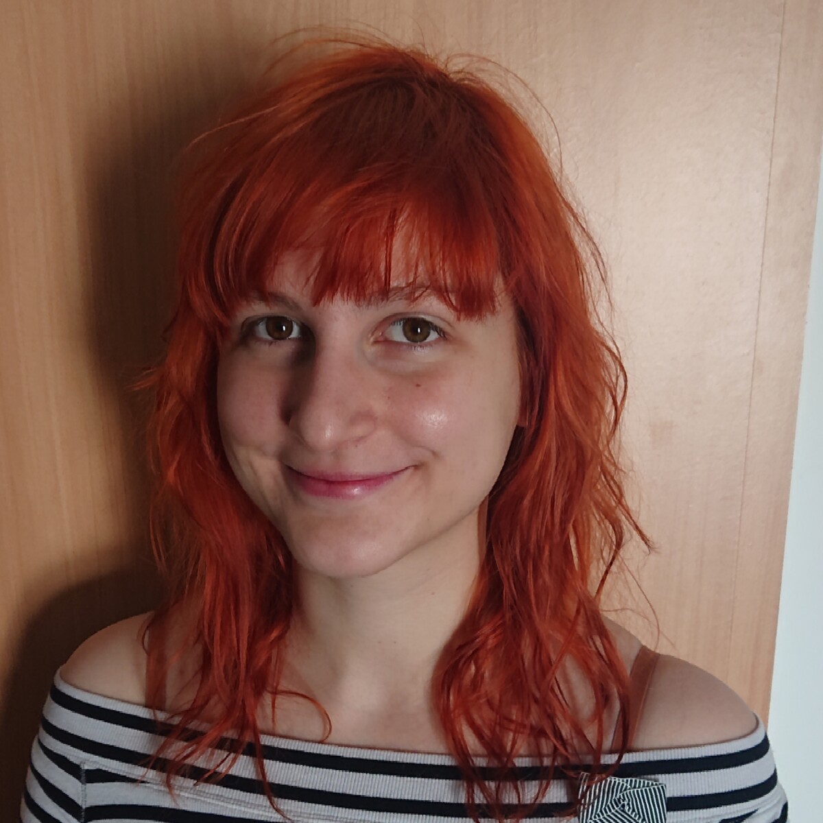 girl with red hair in black-white tshirt