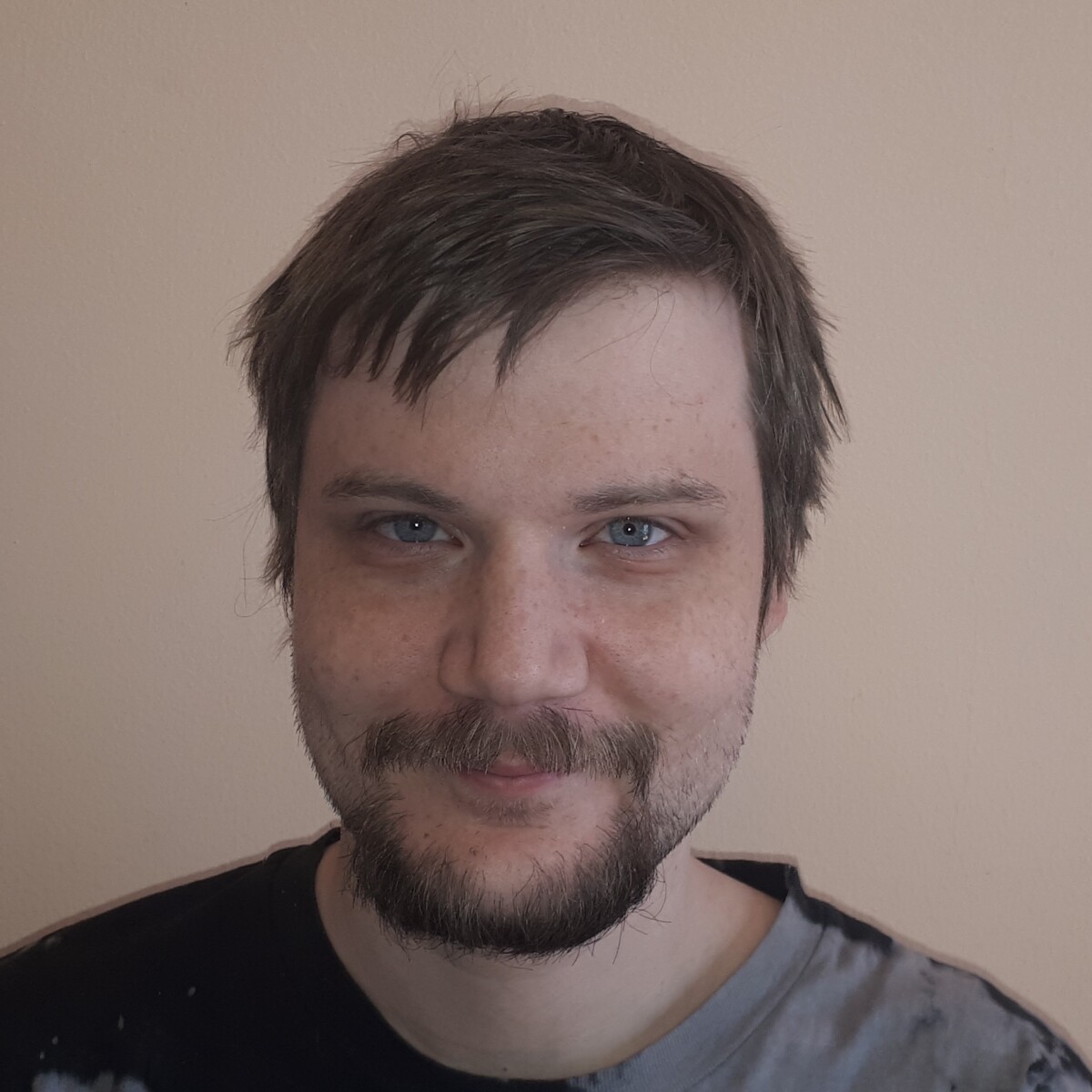 man with beard, wearing grey t-shirt