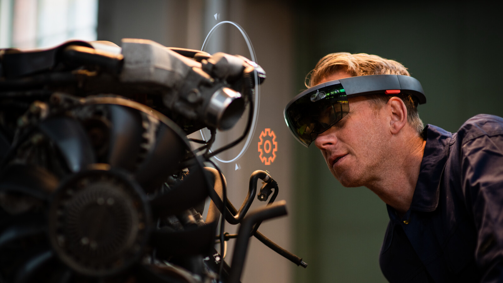 Person working using HoloLens when inspecting machine.