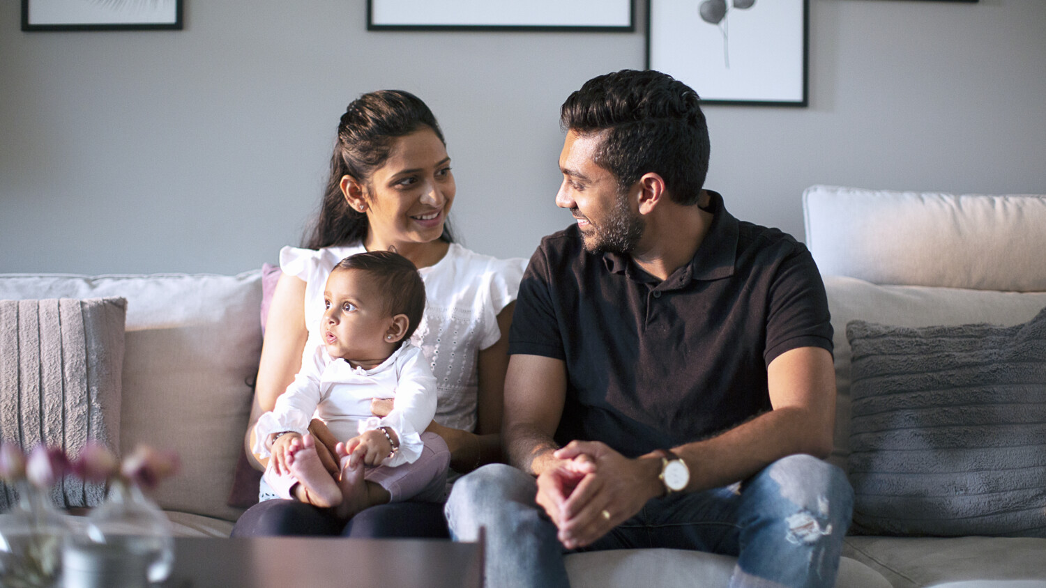 Family sitting together with child.