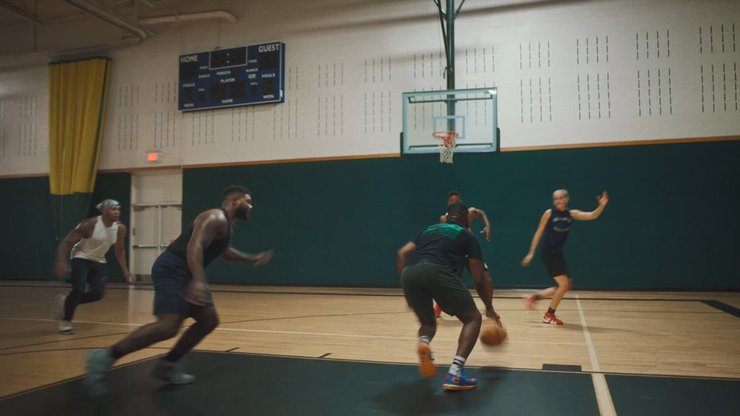People playing basket ball.