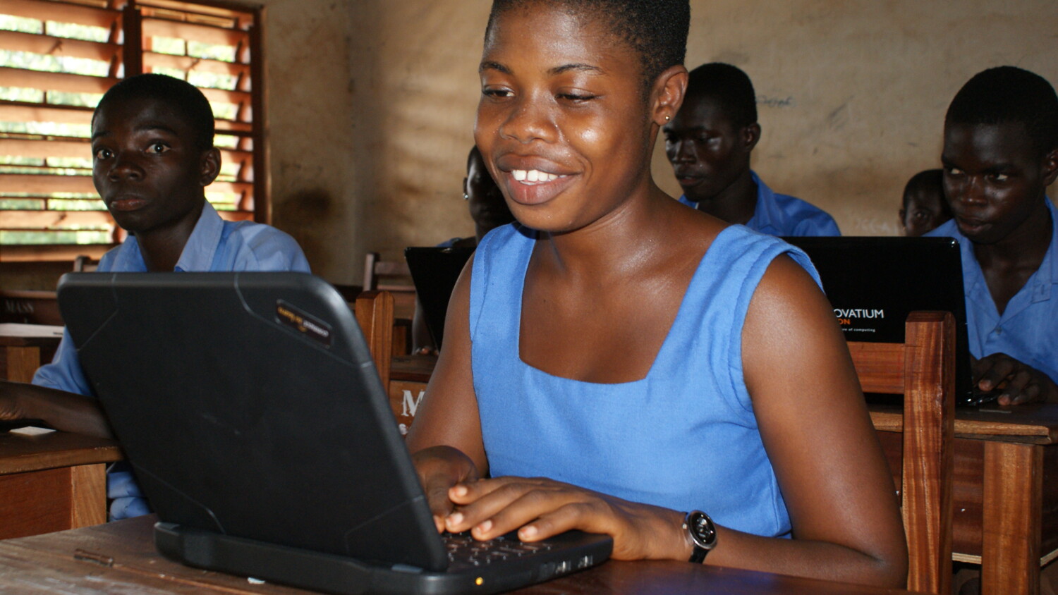 Students working on laptops.