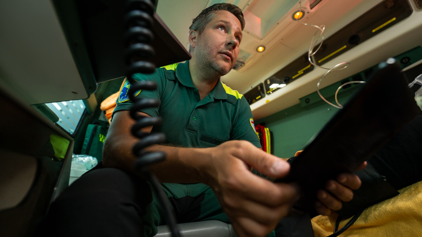 Two firefighter looking at a fire in a building.