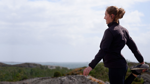 Woman jogging with wireless earphones