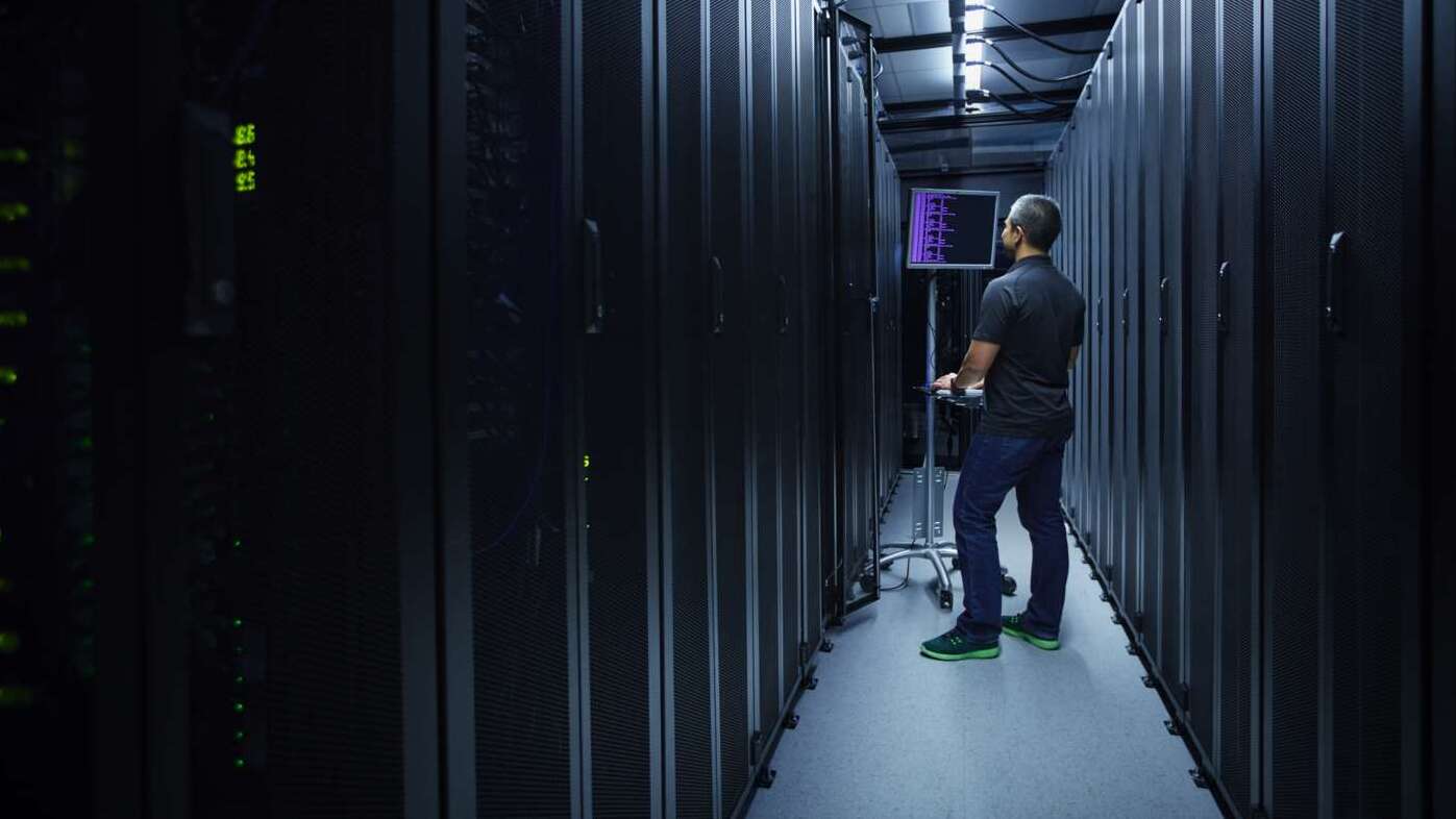 Man in server room with 5G security - enabling a trustyworthy 5g Network