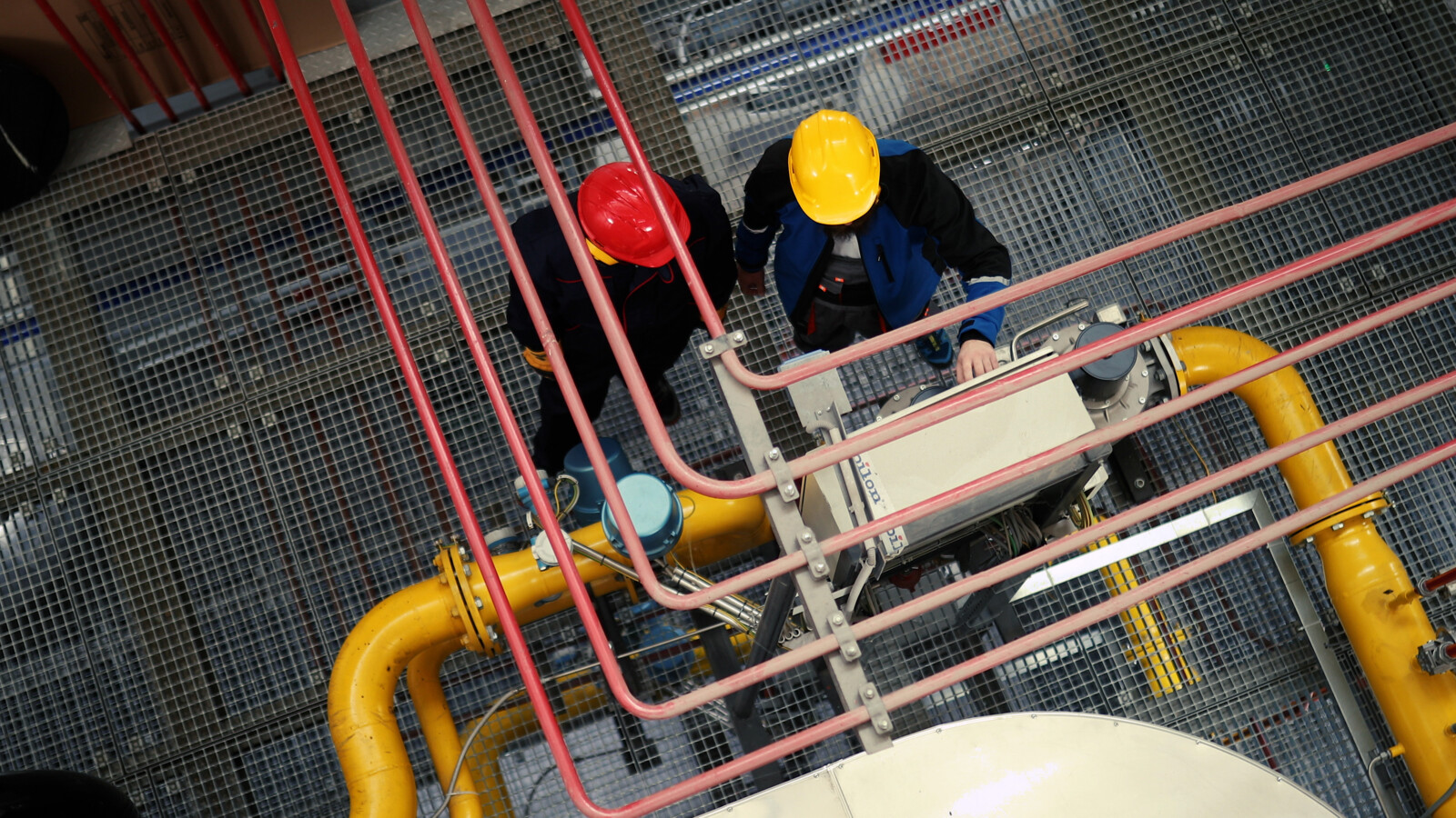 Workers inspects industrial equipment are refinery 