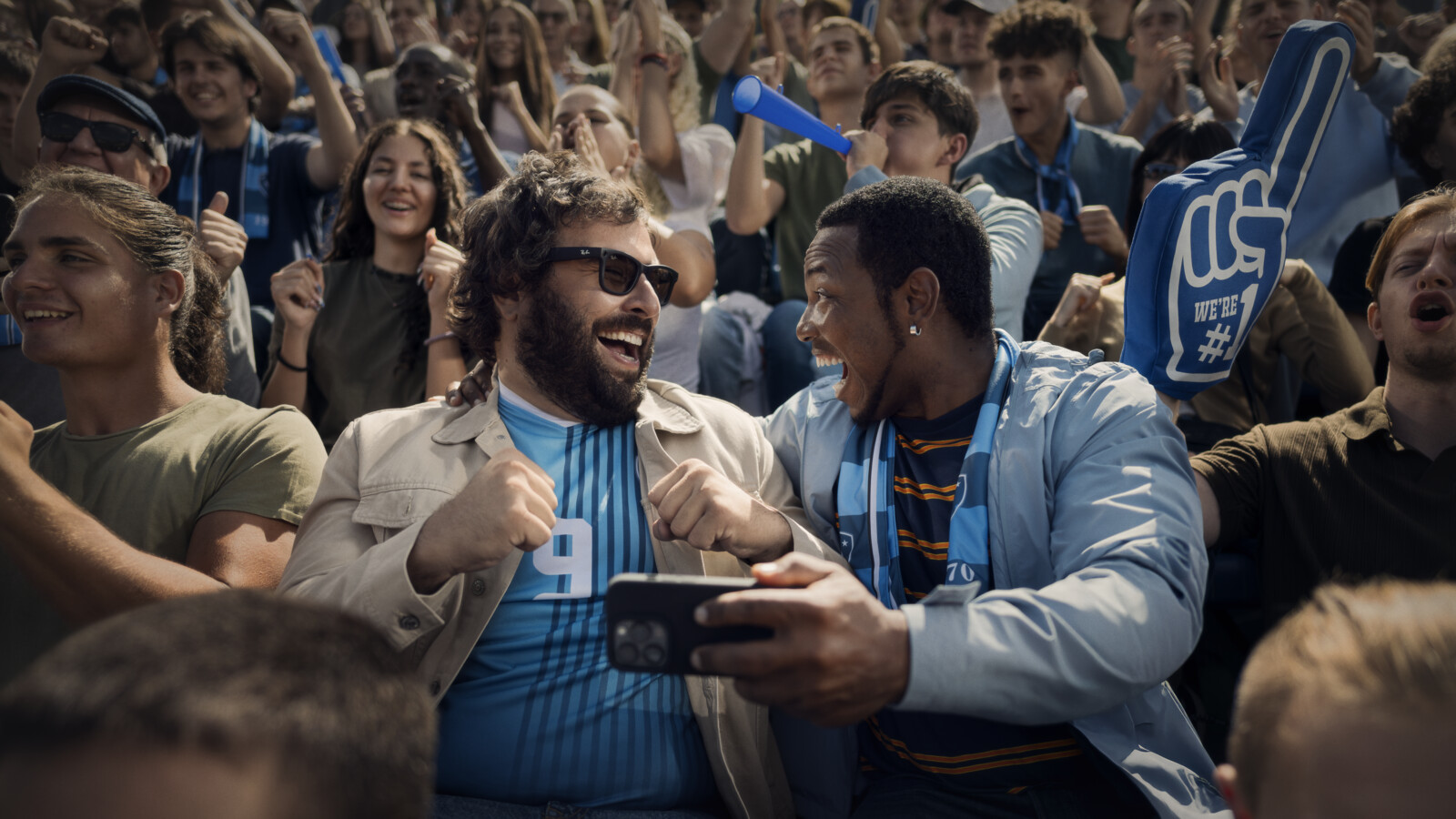 People celebrating in stadium.