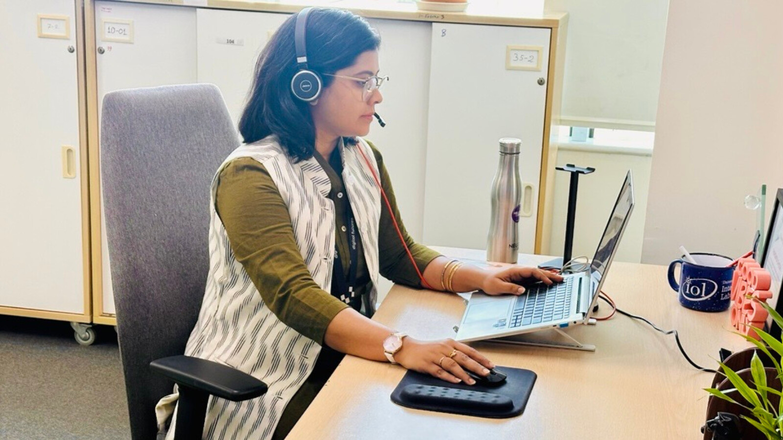 Paromita working at her desk