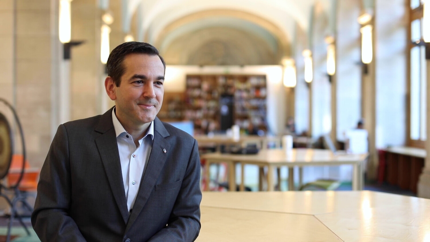 Person sitting in a office environment.