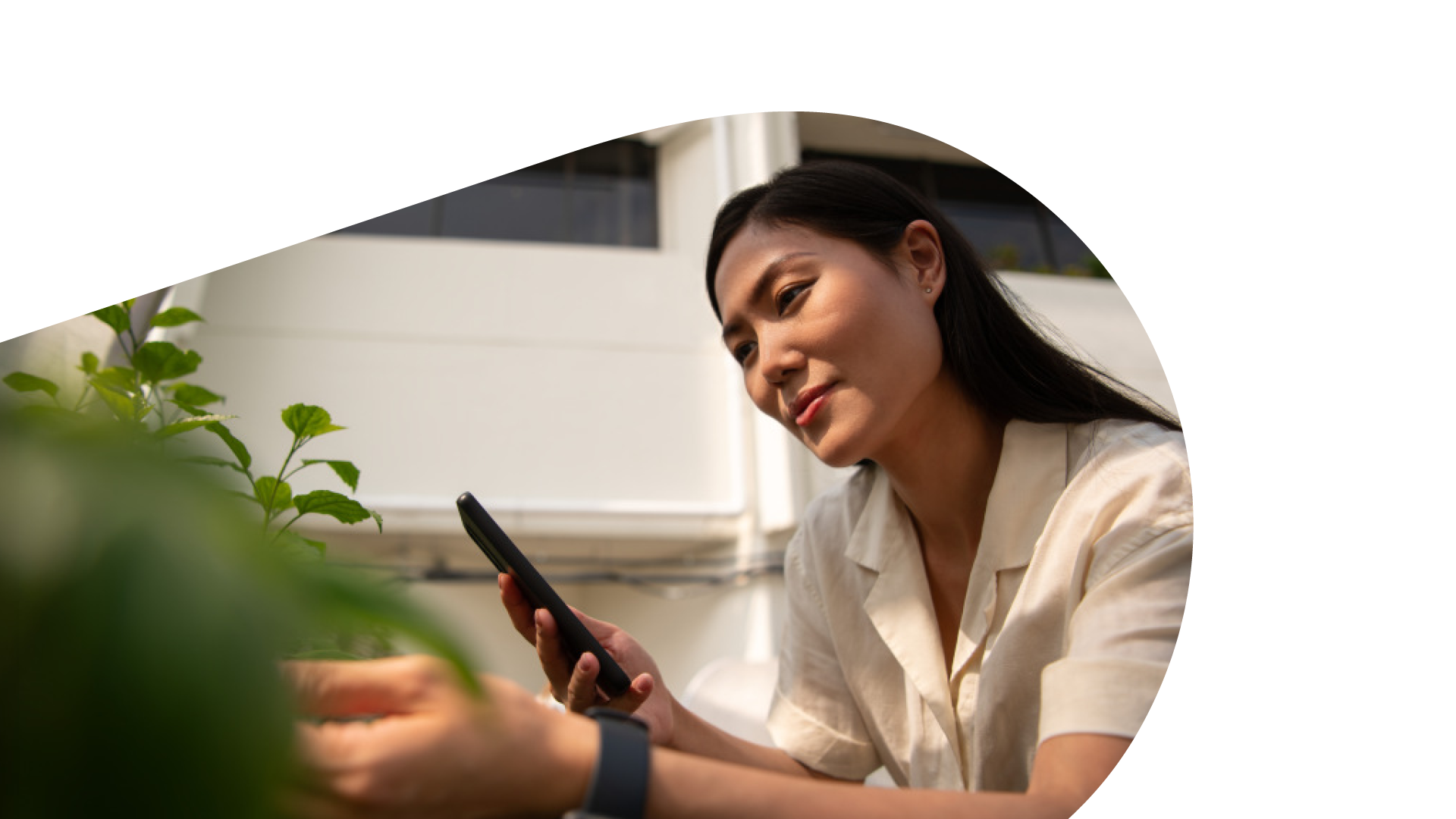 woman holding her phone