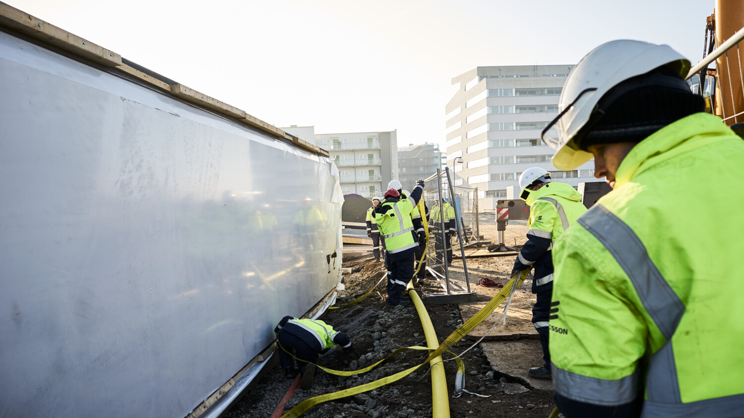 Installation team at urban utility in a city.