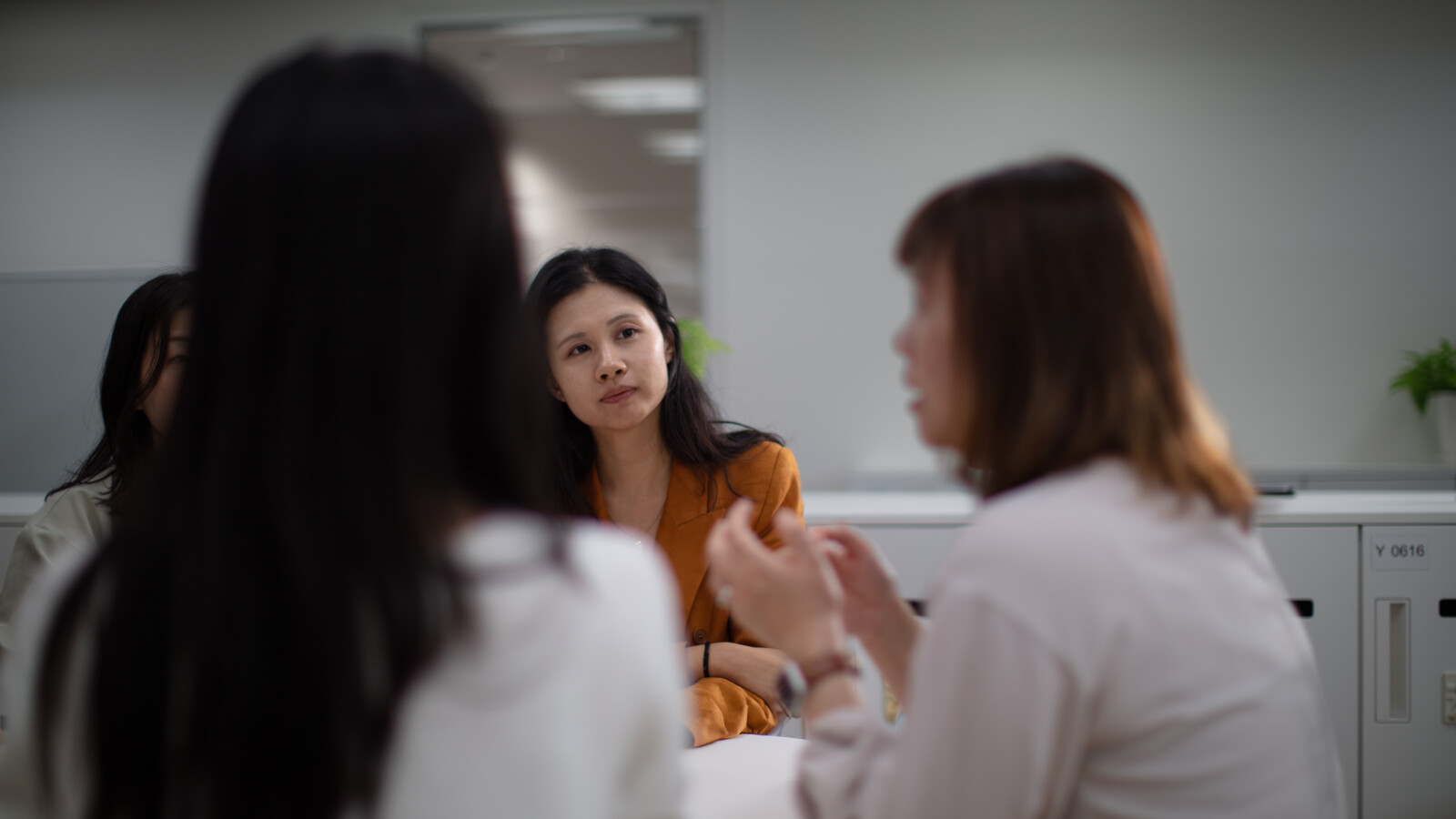 Female employees engaged in a discussion