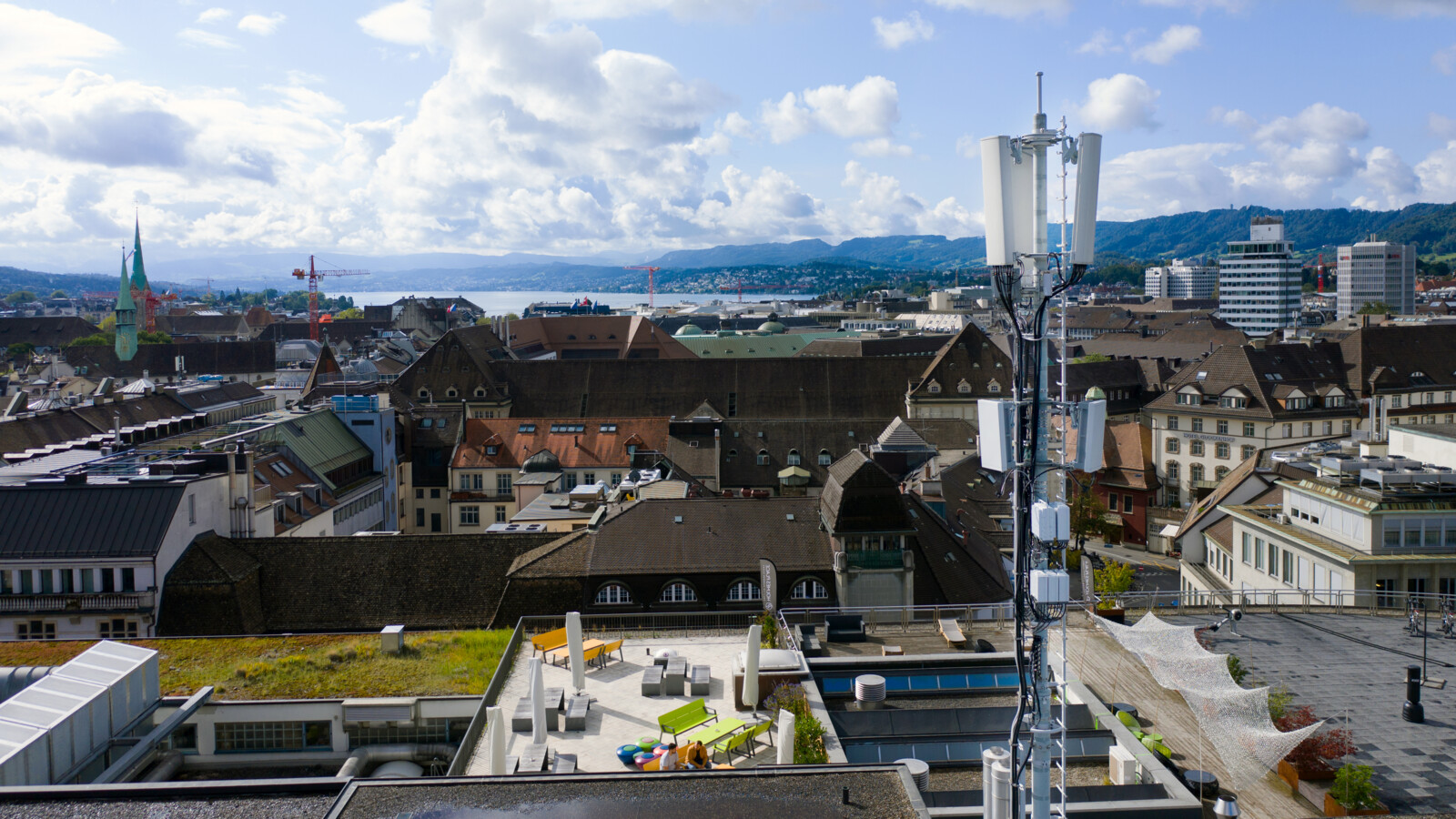 City view with antennas on a rooftop.