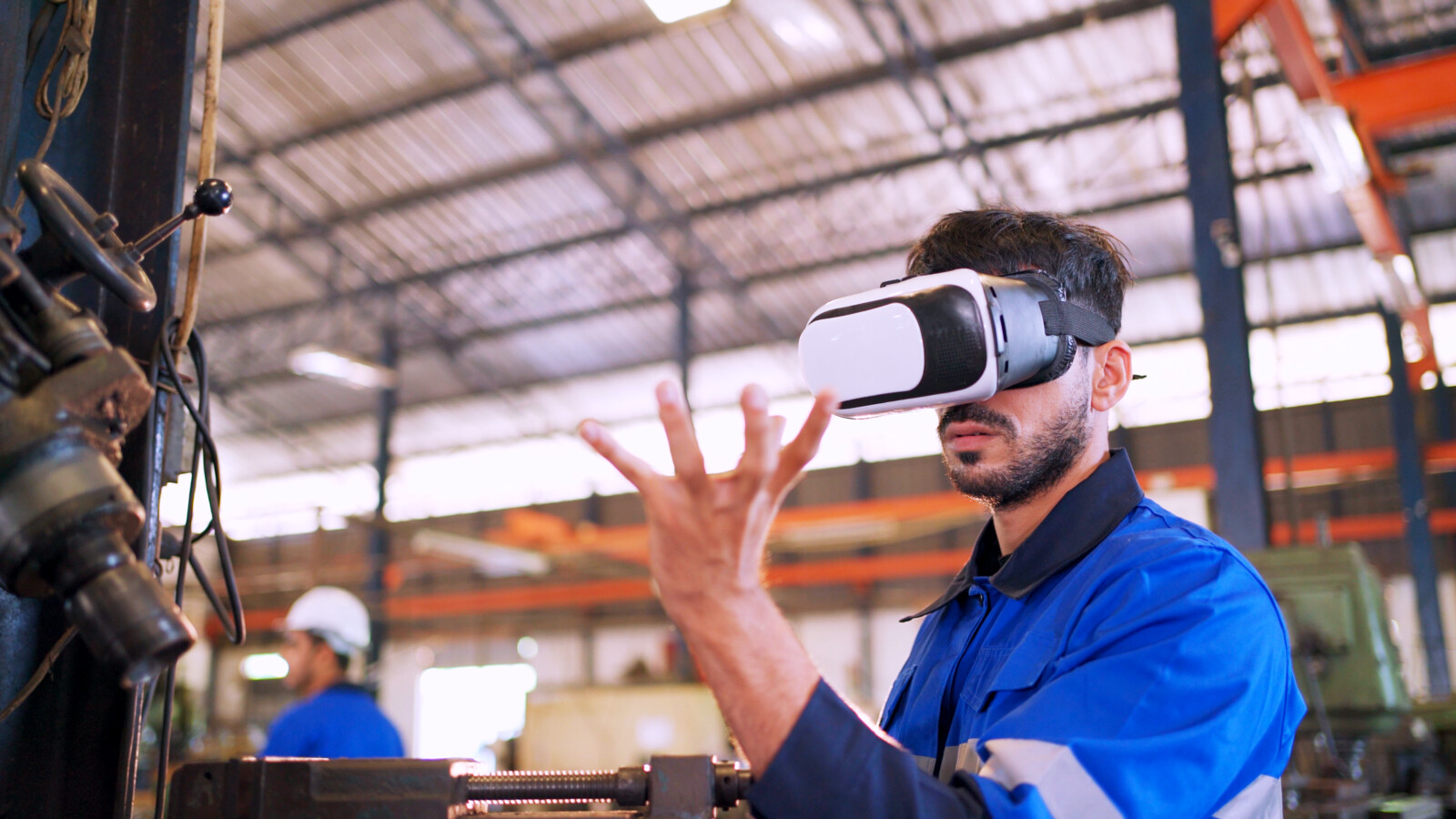 Business engineer wearing virtual reality headset.