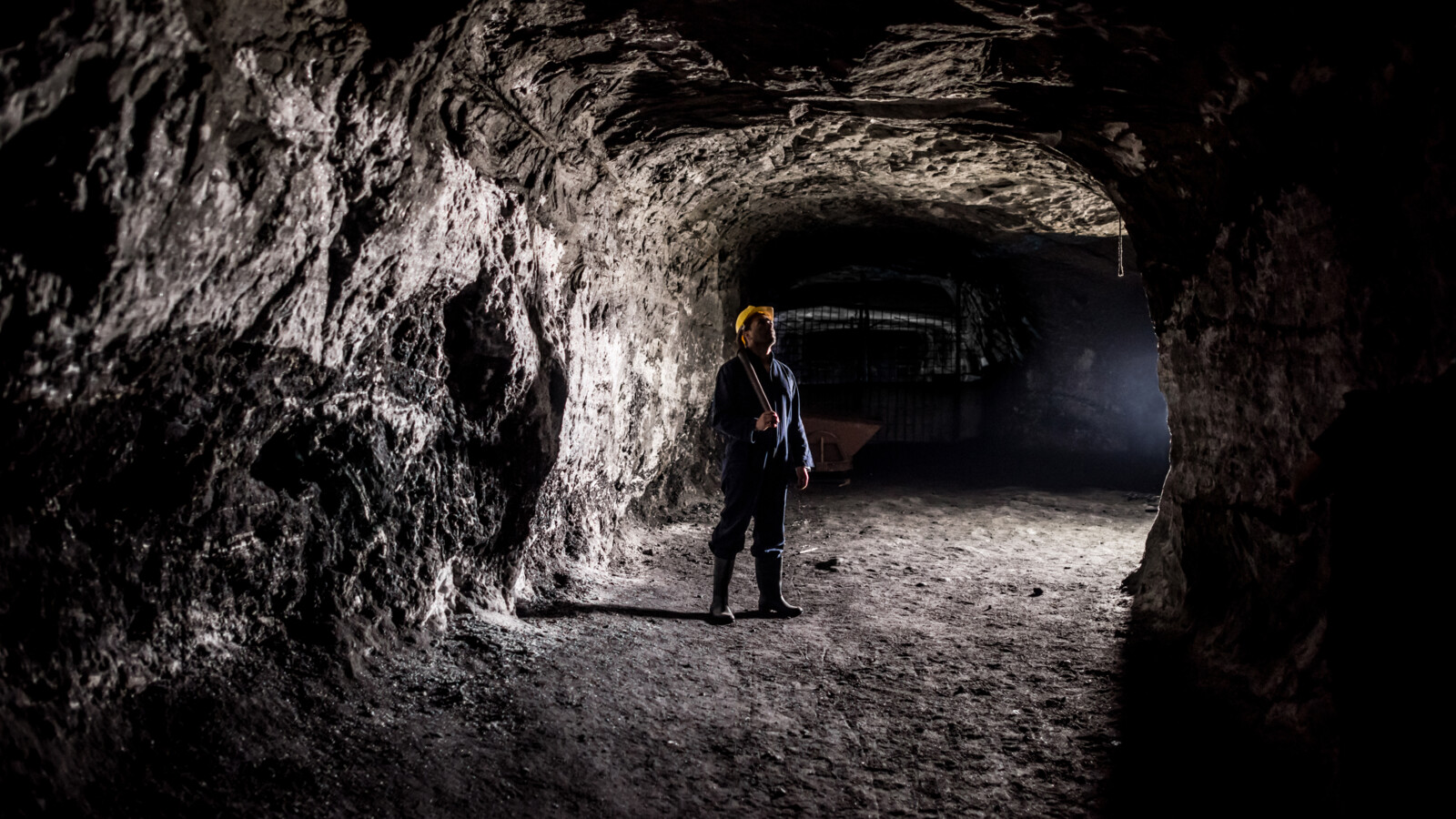 A mine worker in a mine.