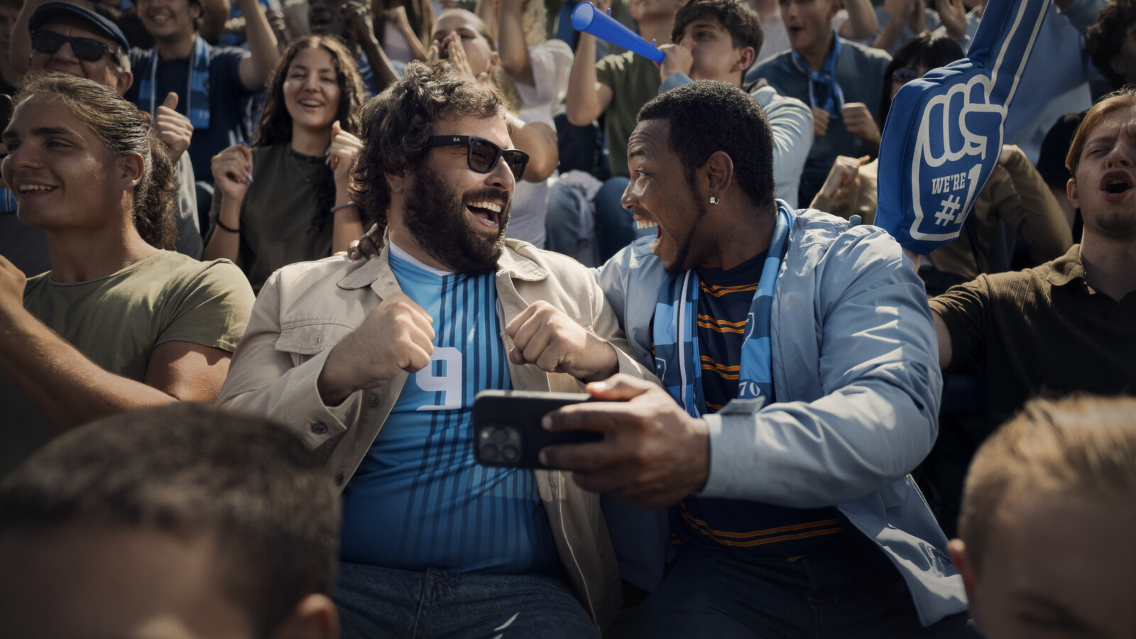 Fans celebrating in the stadium