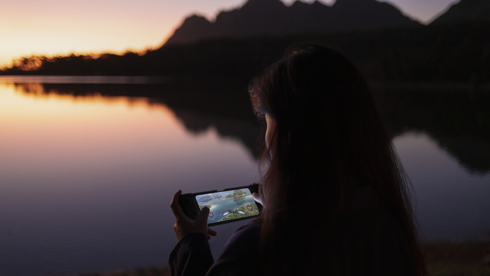 A woman playing a game over 5G on her phone.