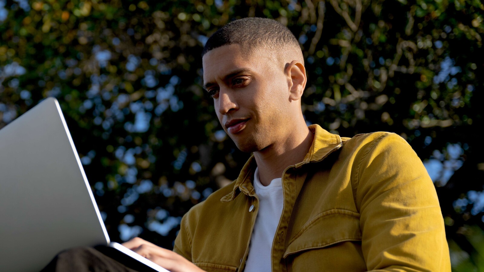 Man on a laptop outside