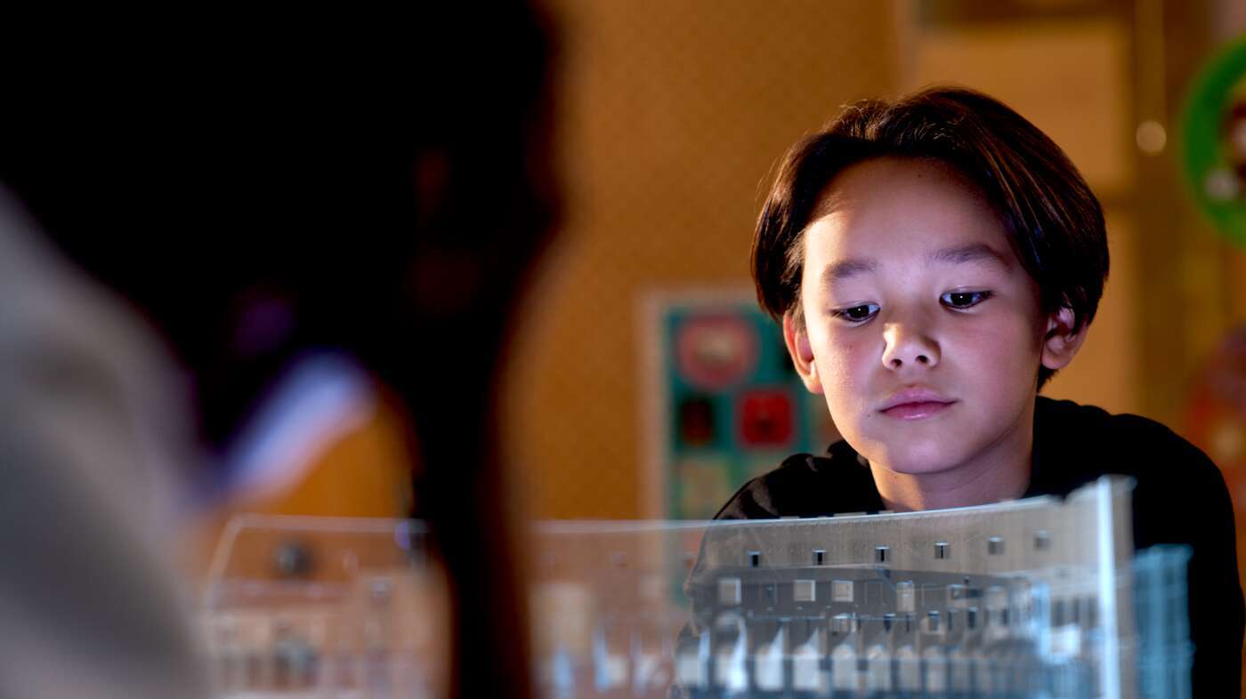 Boy viewing a hologram