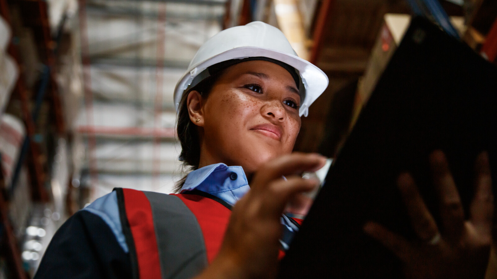 Woman checking warehouse goods with the help of 5G.