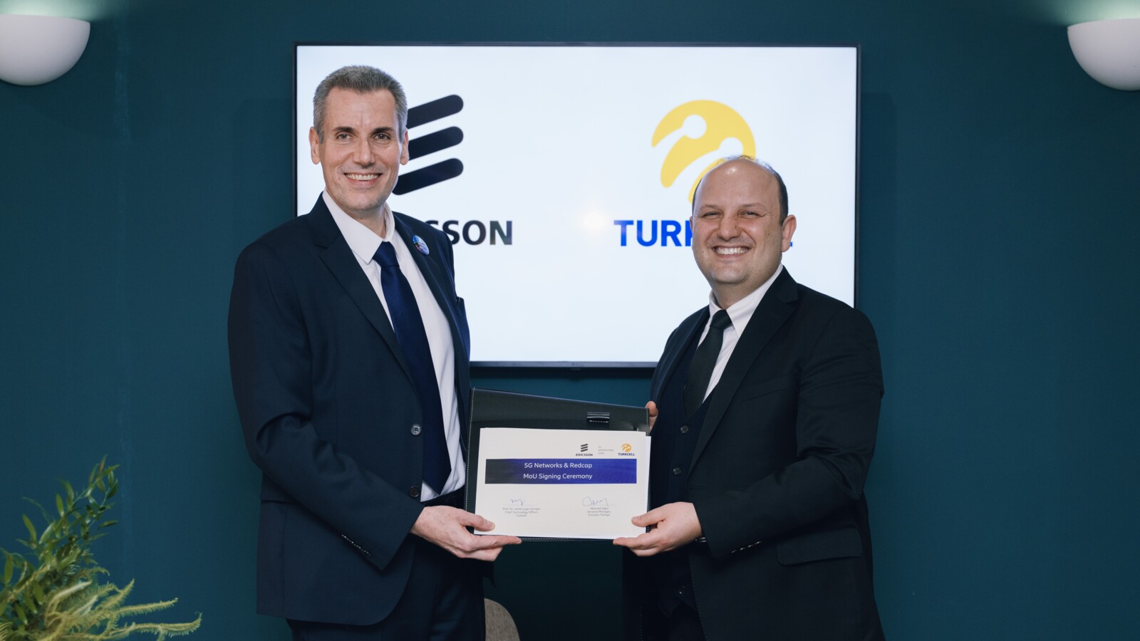 Turkcell and Ericsson representatives sign MoU