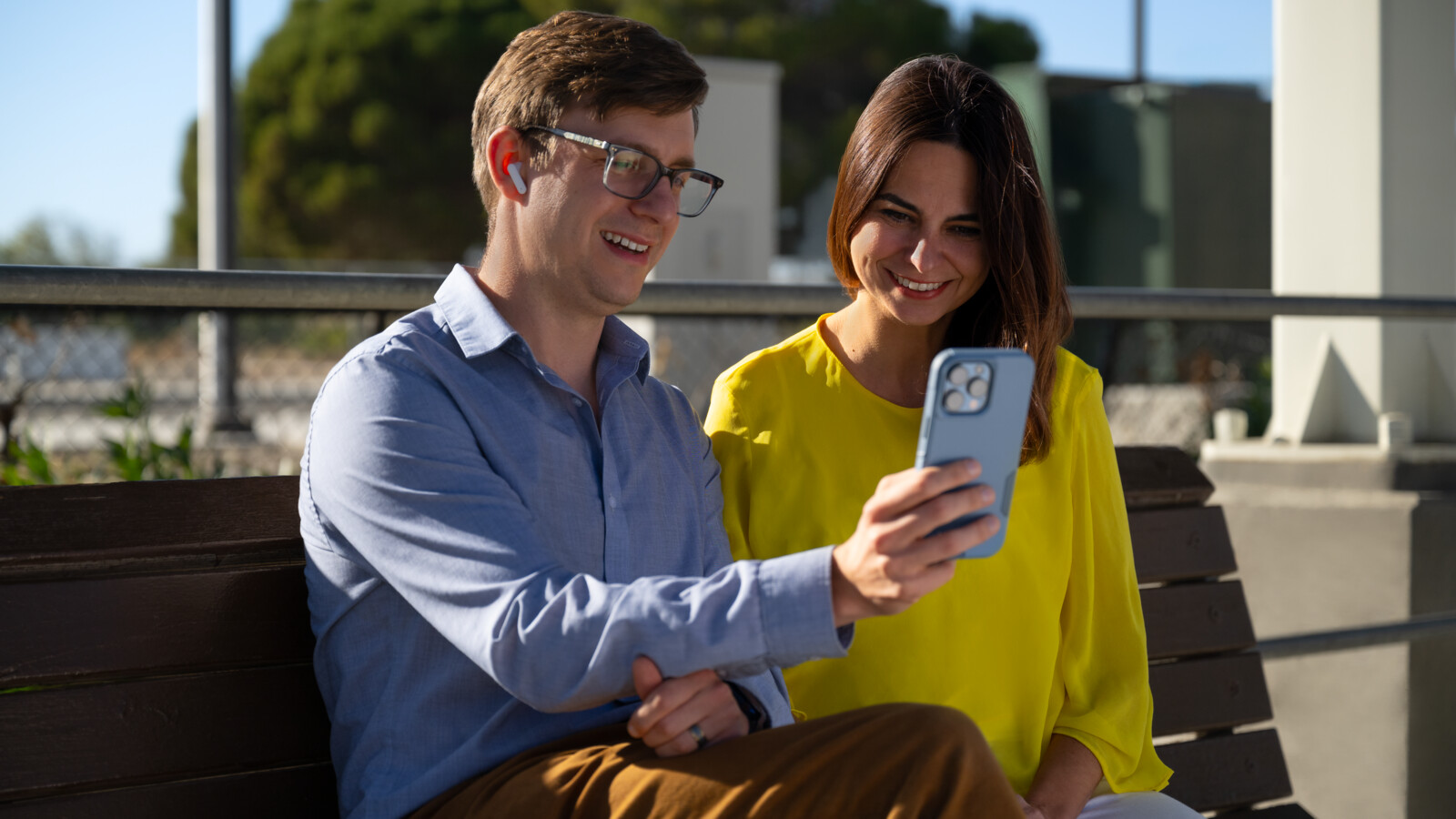 woman and man looking at phone