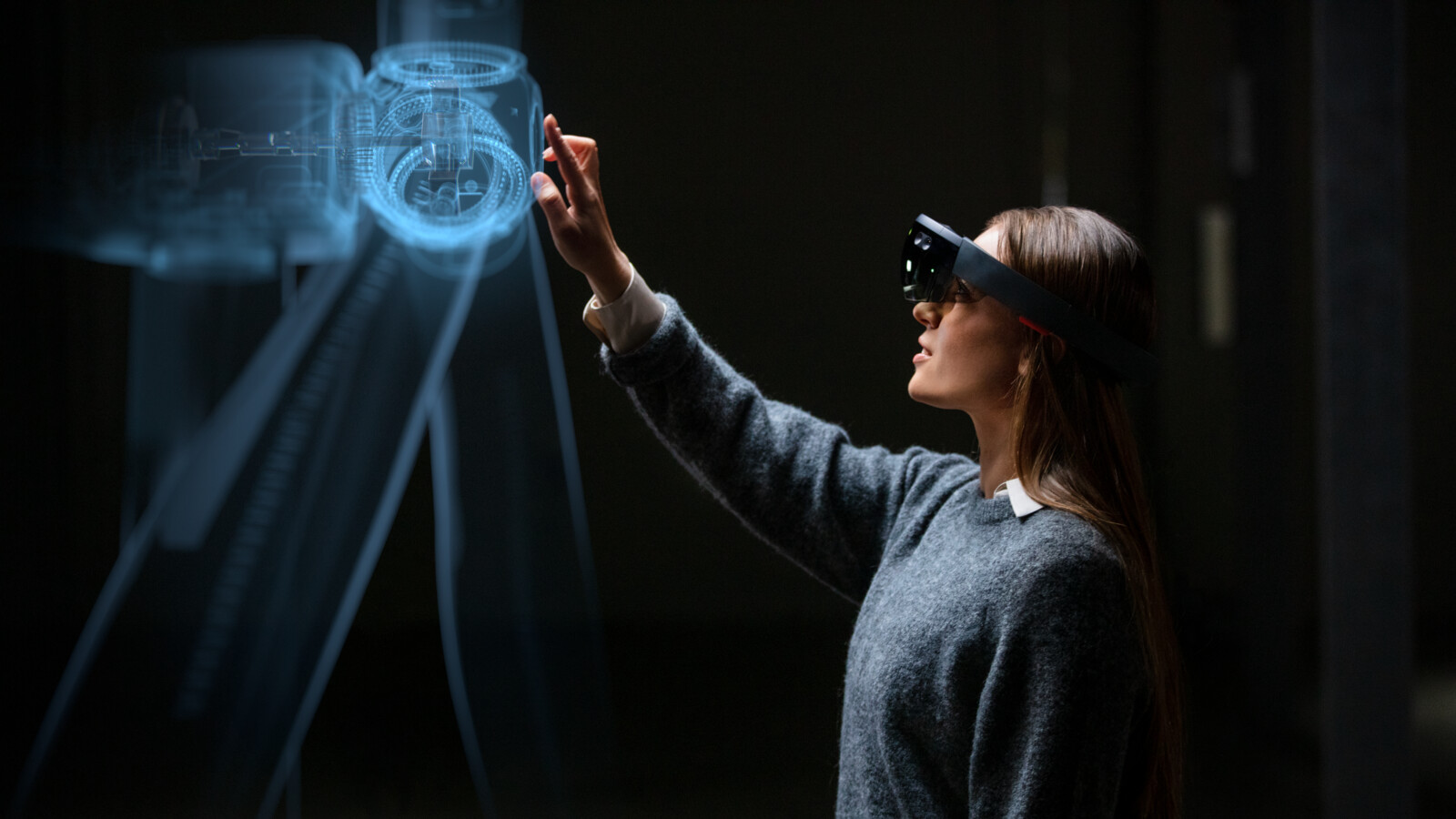 Engineer wearing hololense and working on digital twin technology.