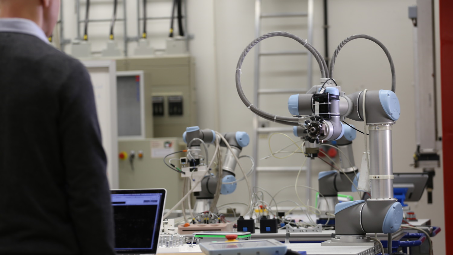 Smart factory in manufacturing line  with robot assembling a printed circuit board to display the IIoT and smart manufacturing.