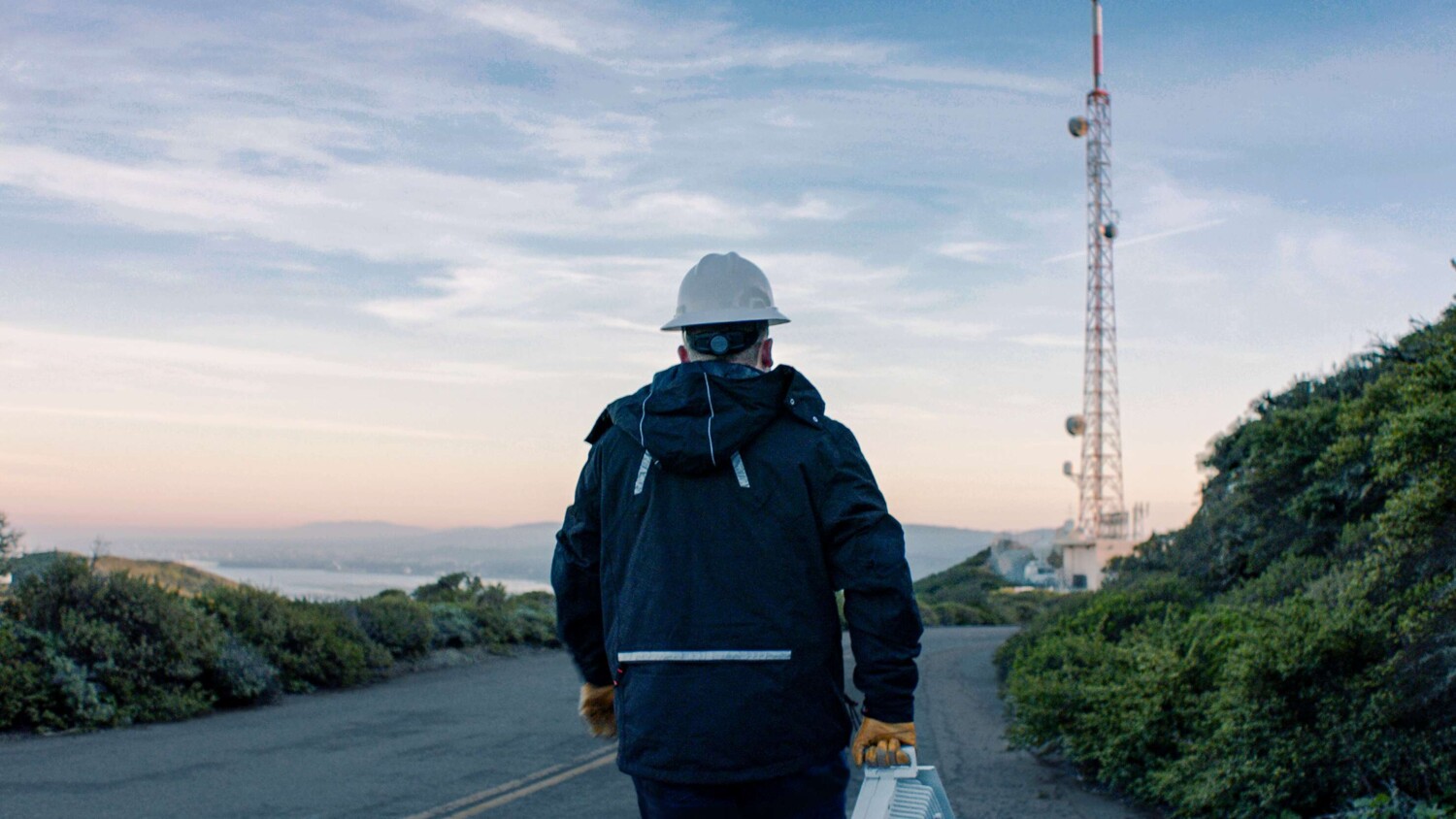 Ericsson employee walking toward an antenna
