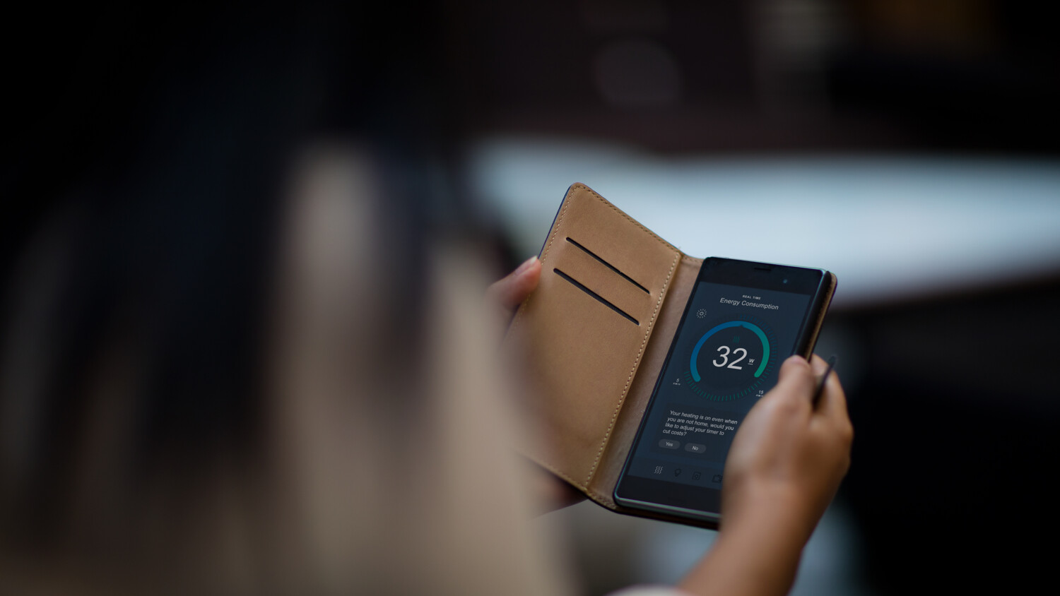 Person with mobile phone in hand.