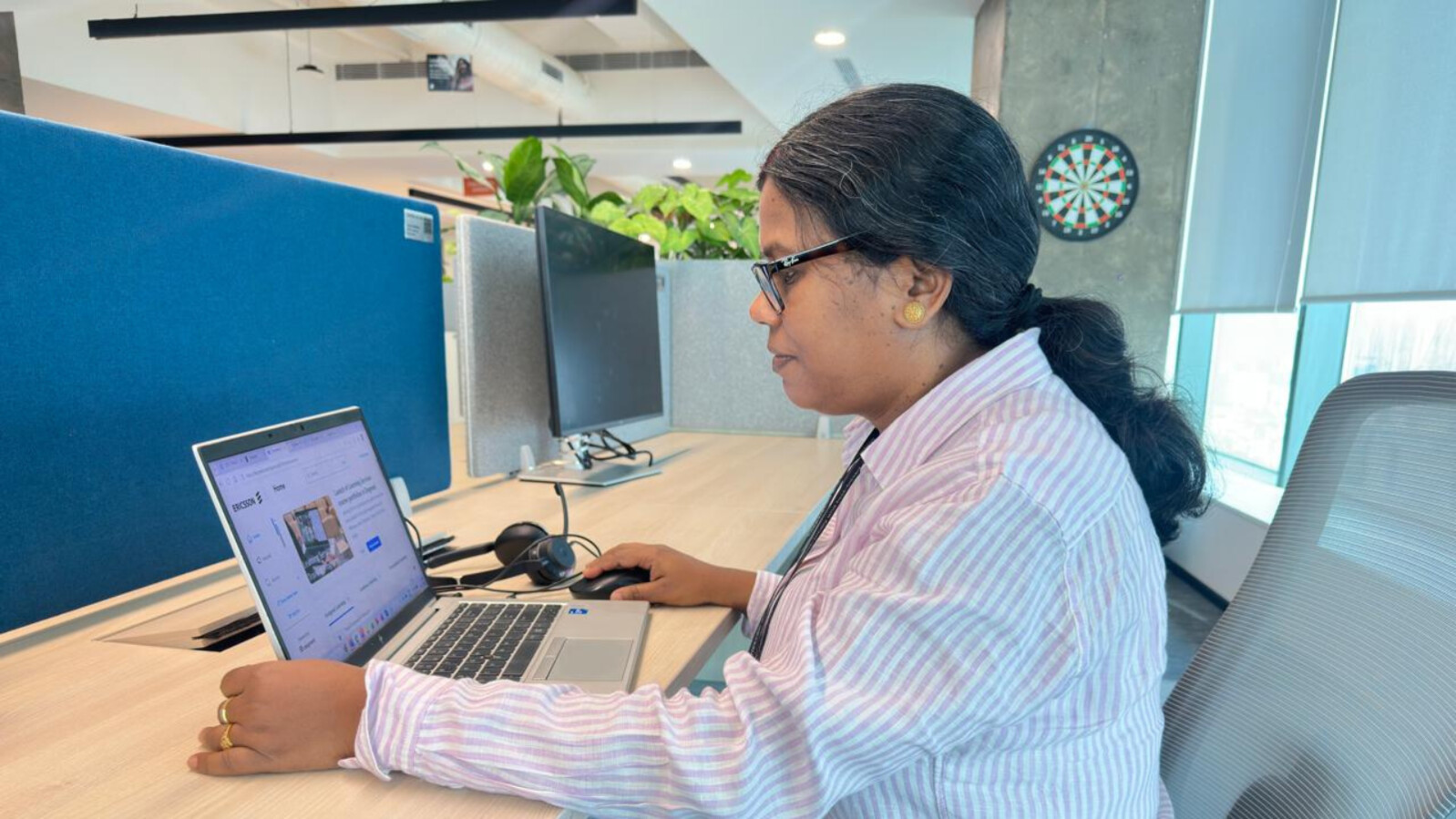 Anima Dey working at her desk 