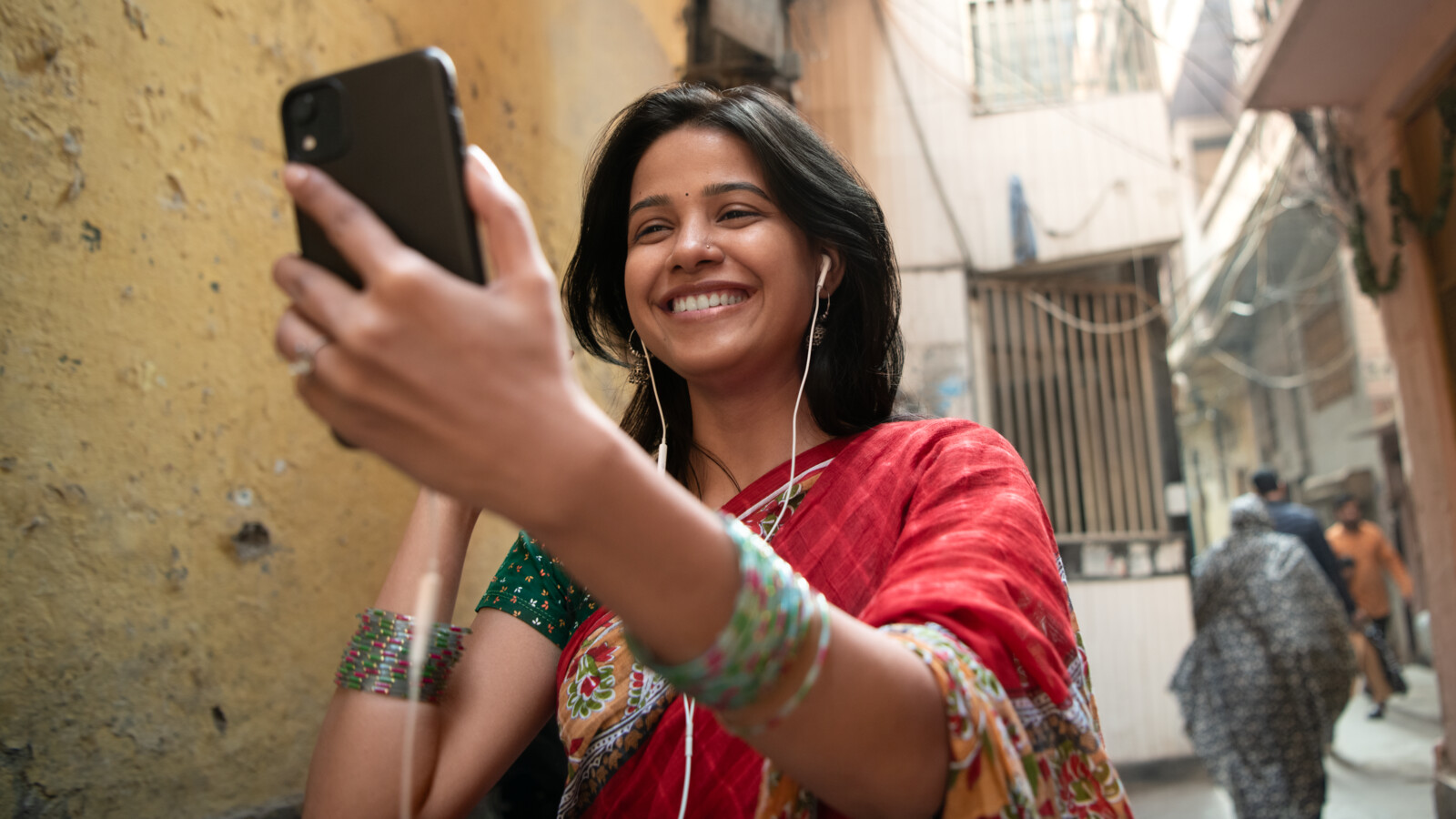 Woman walking down street having a video call