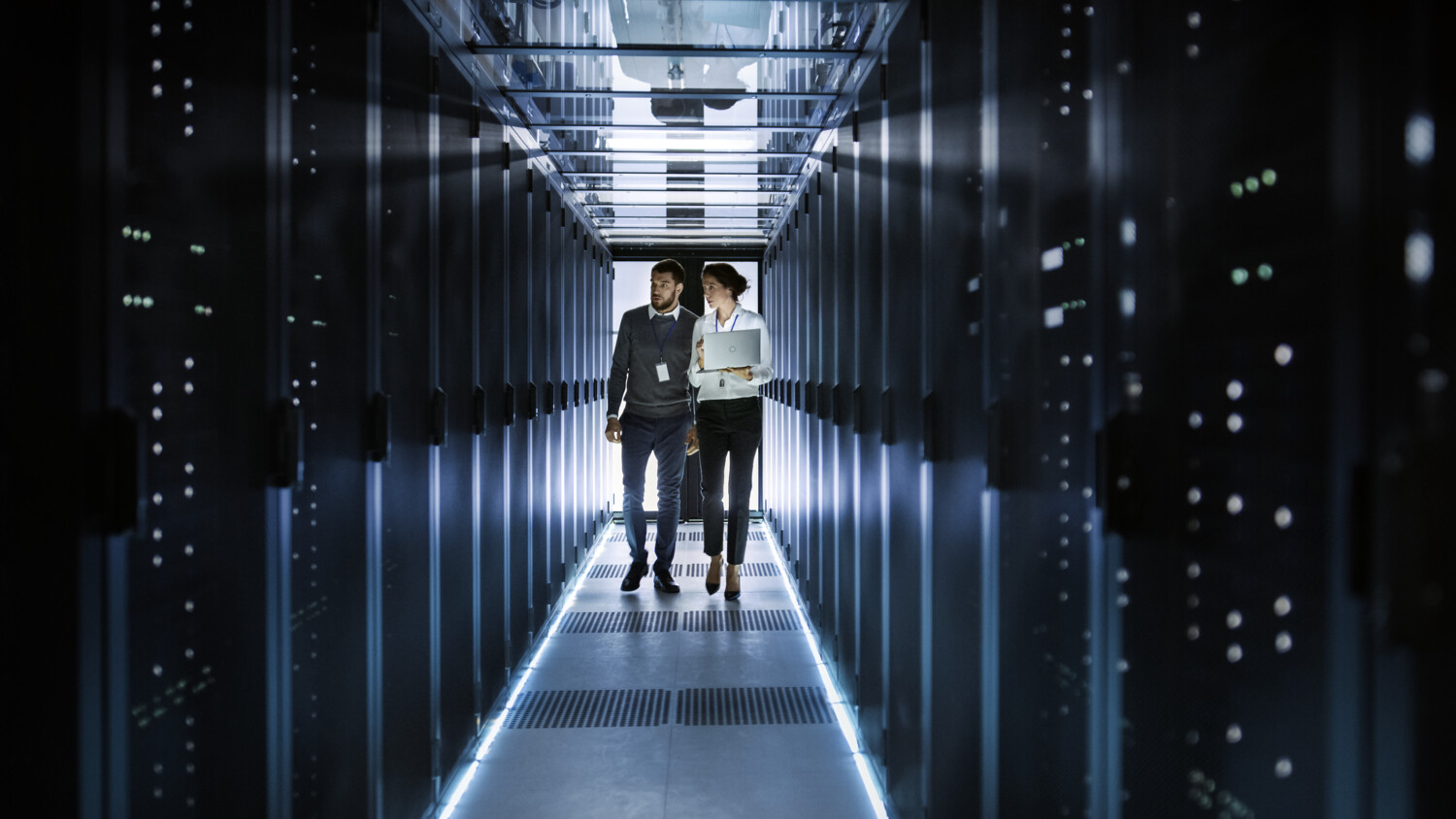 Employees in a data server room.