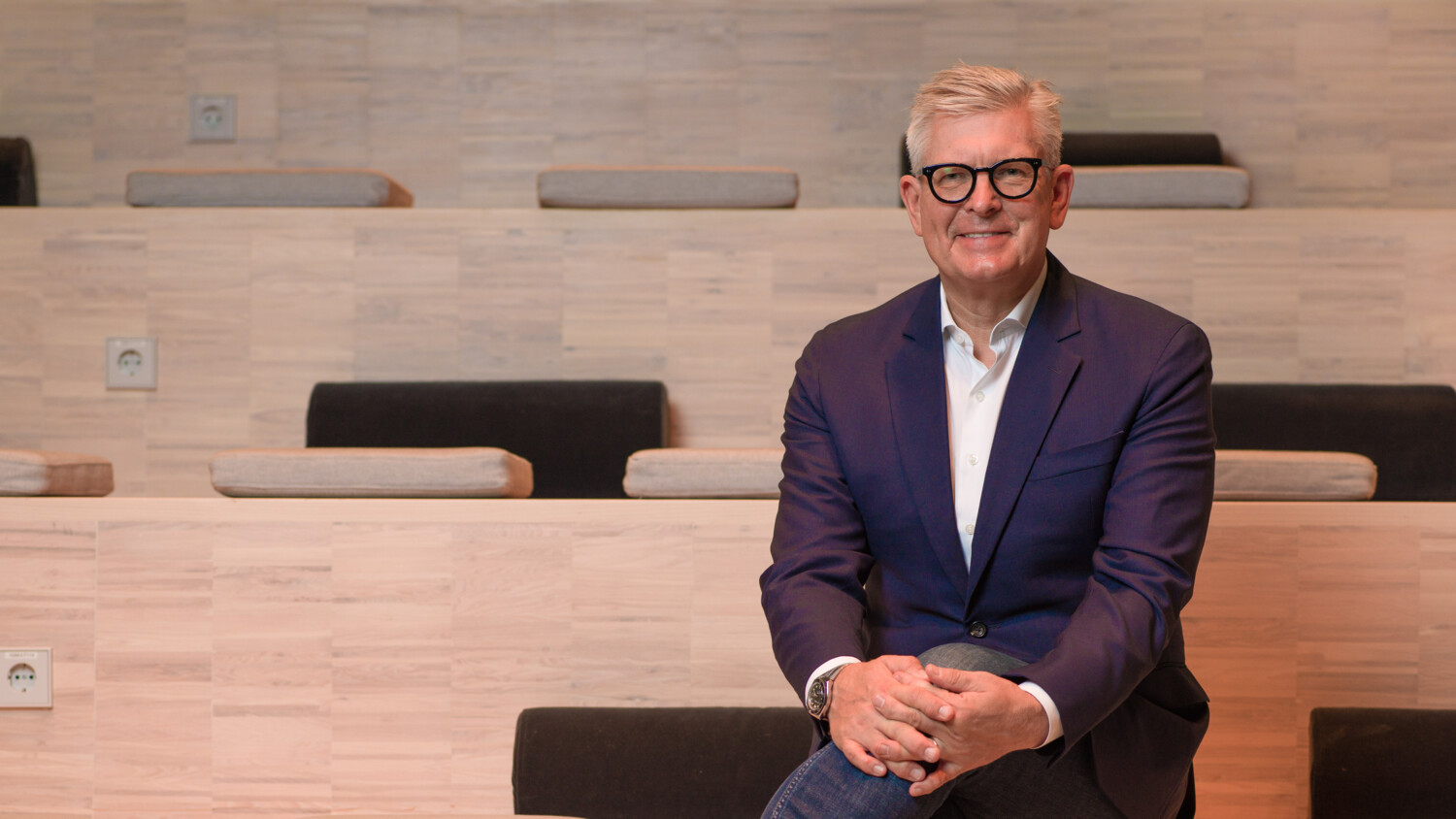 Börje Ekholm sitting and smiling