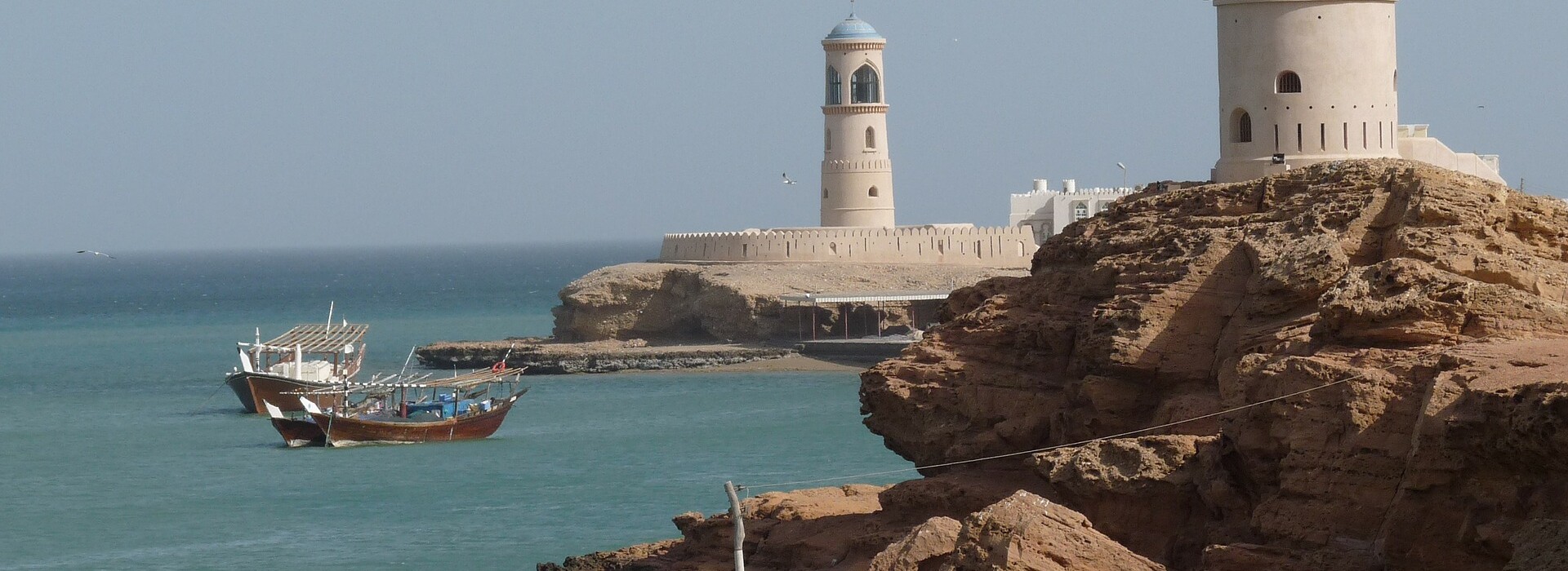 Fishing boats in the waters outside a port in Oman.