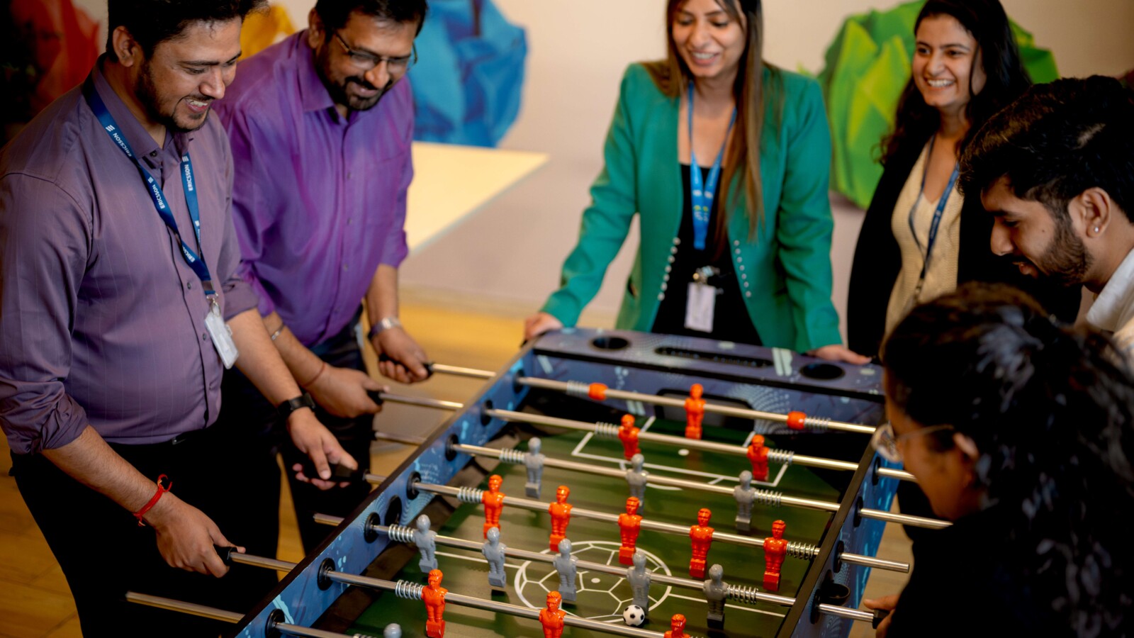 Ericsson employees playing 'foosball' in the office