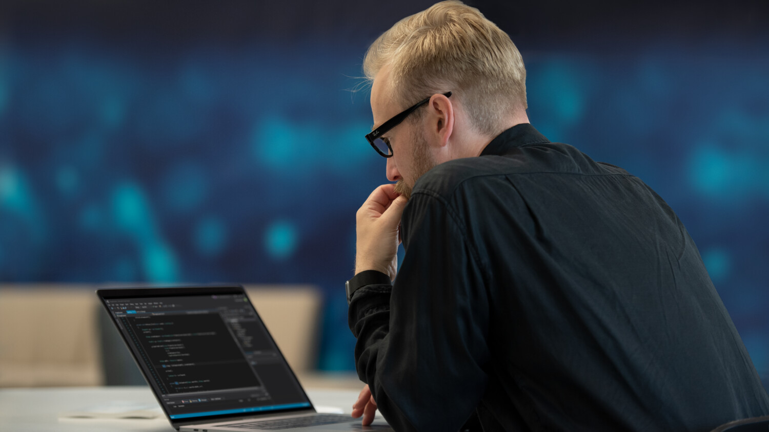 Man working on laptop in office