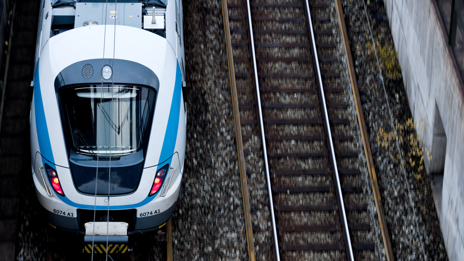 Overhead view of train on railway tracks.