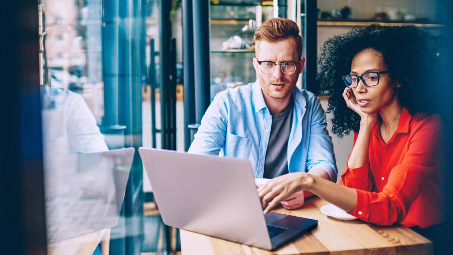 Two colleagues collaborating on business operations