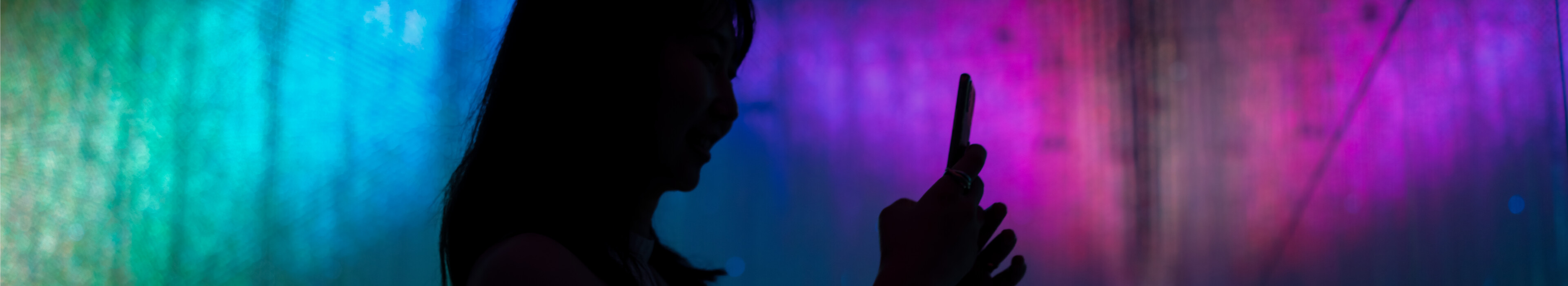 A woman interacts with a phone