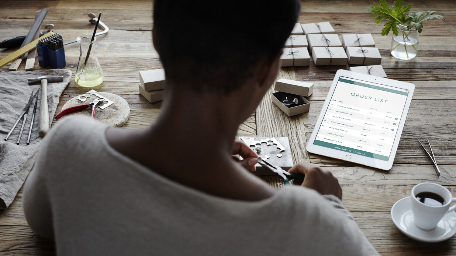 Woman looking at mobile device while working