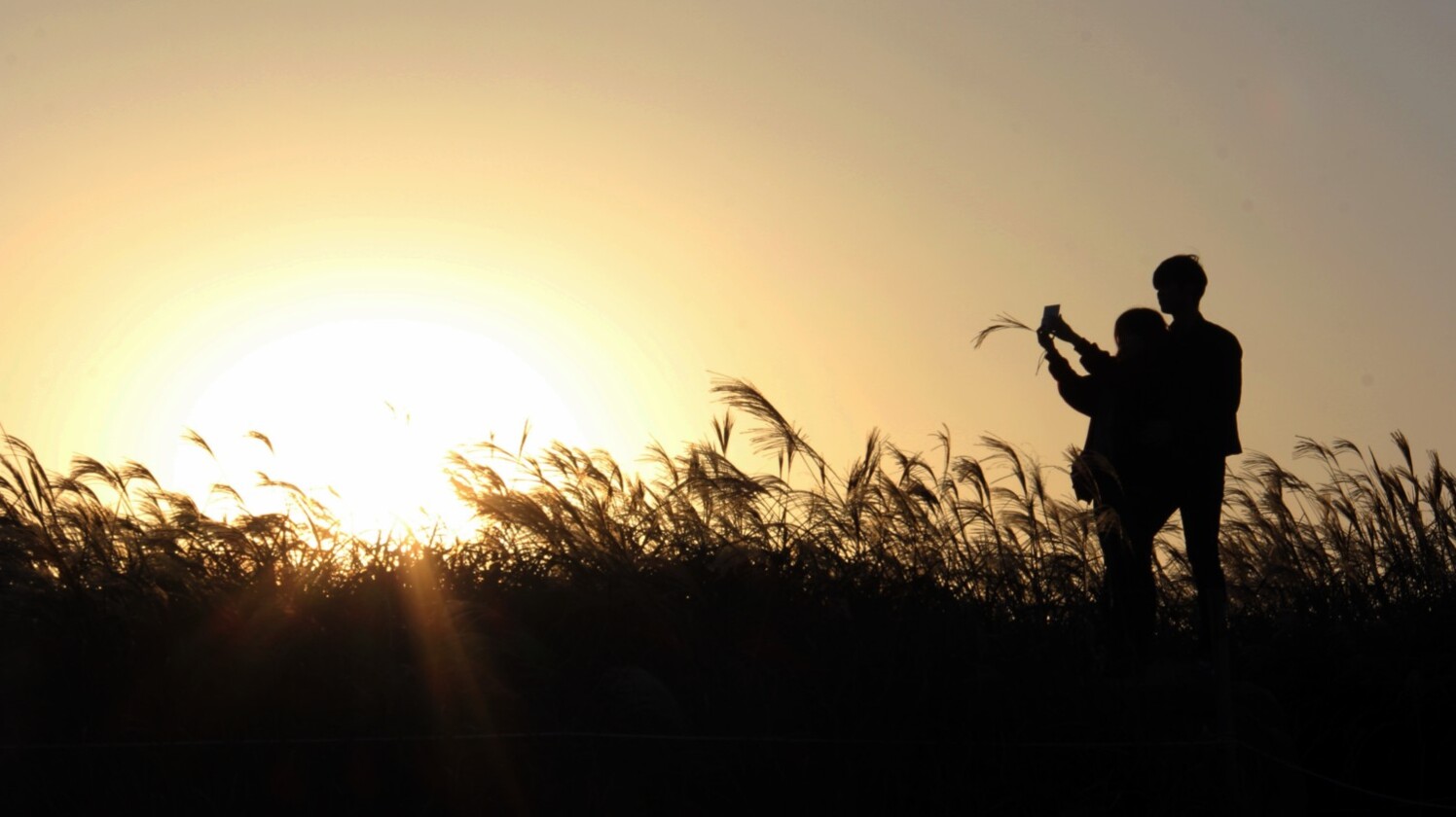 young couple with mobile device