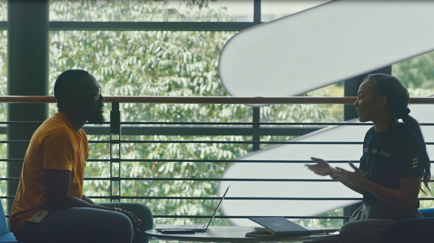 Colleagues discussing indoors