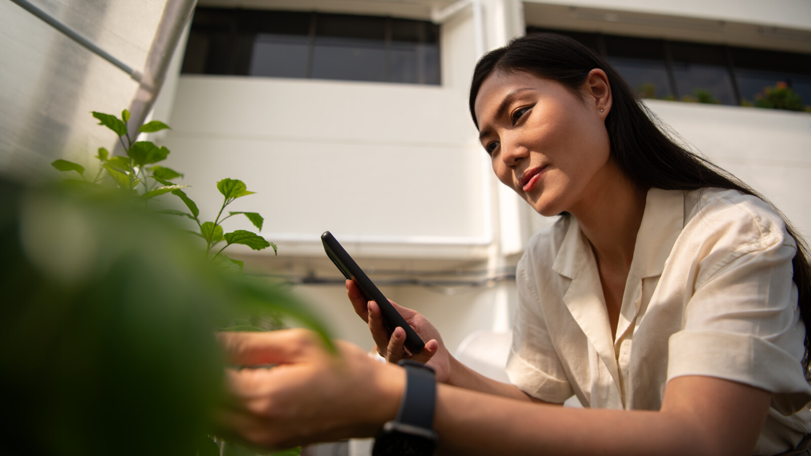 Woman watching video on smart phone.
