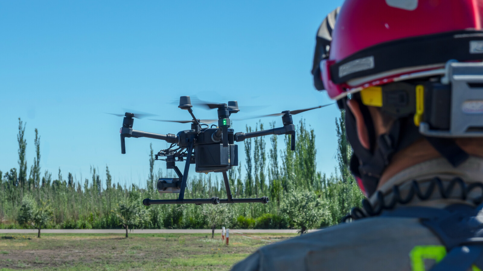 Firefighter flying rescue drone