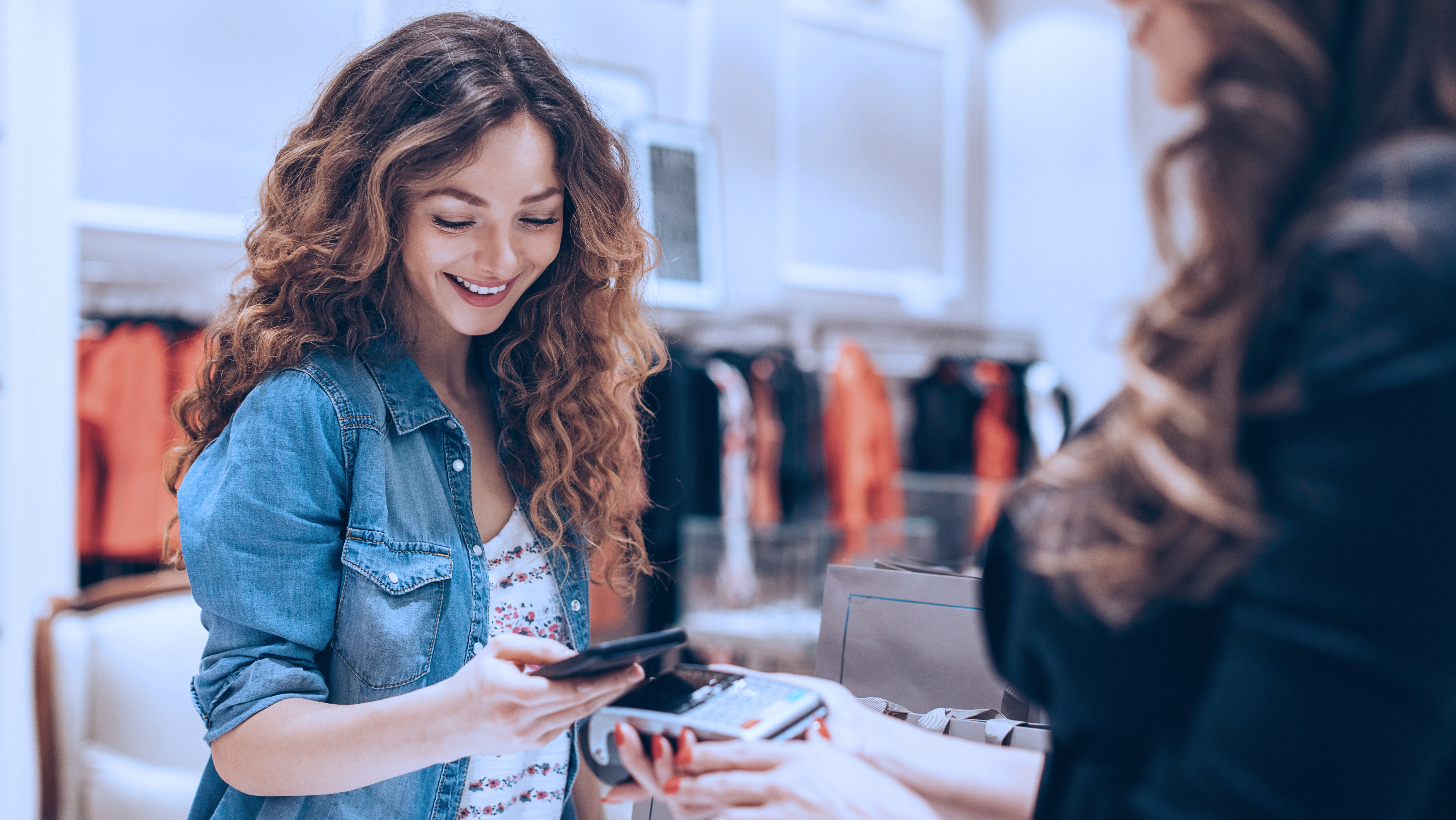 Person paying with mobile phone.
