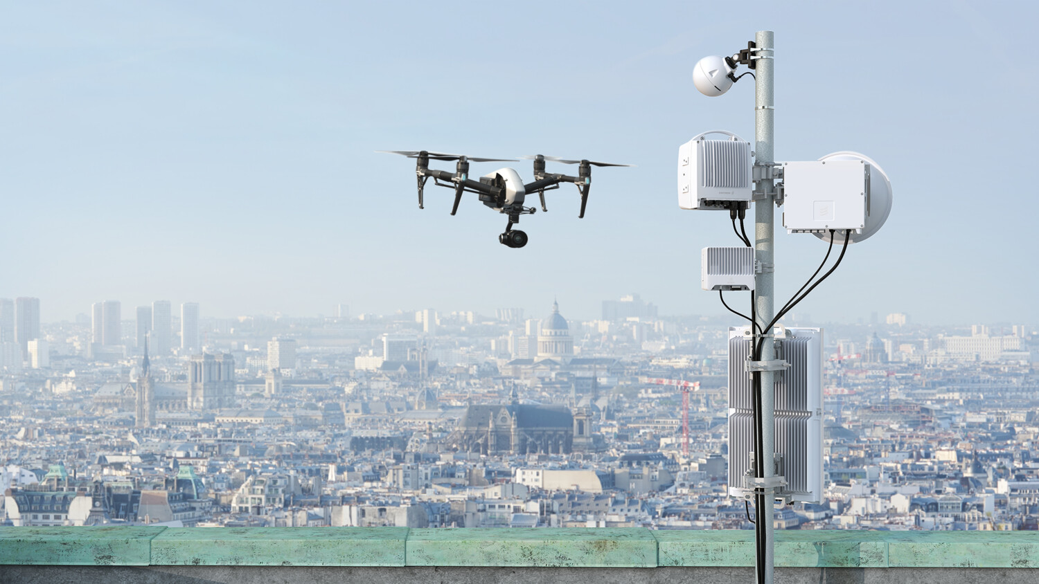 Video surveillance by drone with city in the background. 