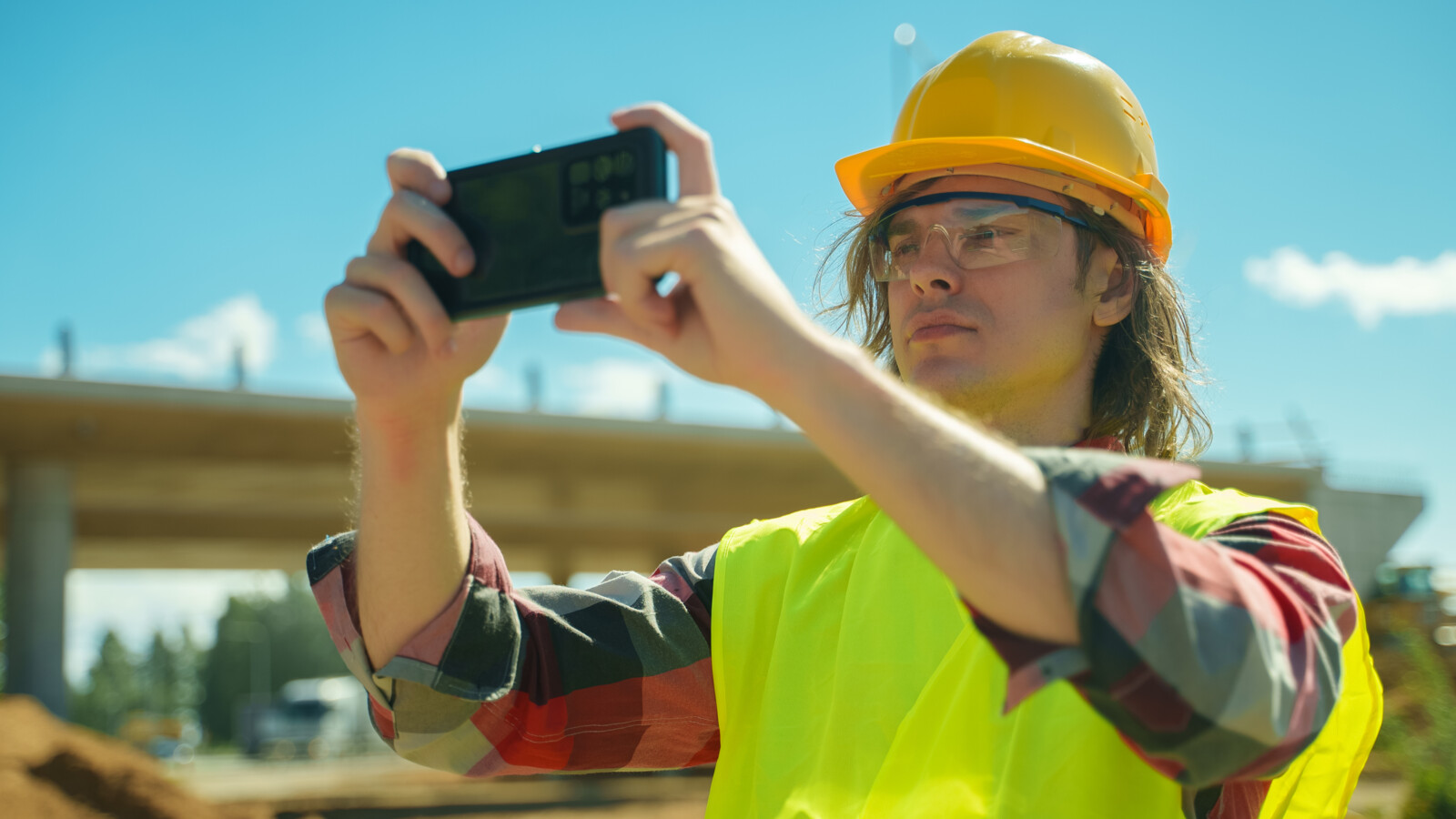 Construction safety worker with iphone